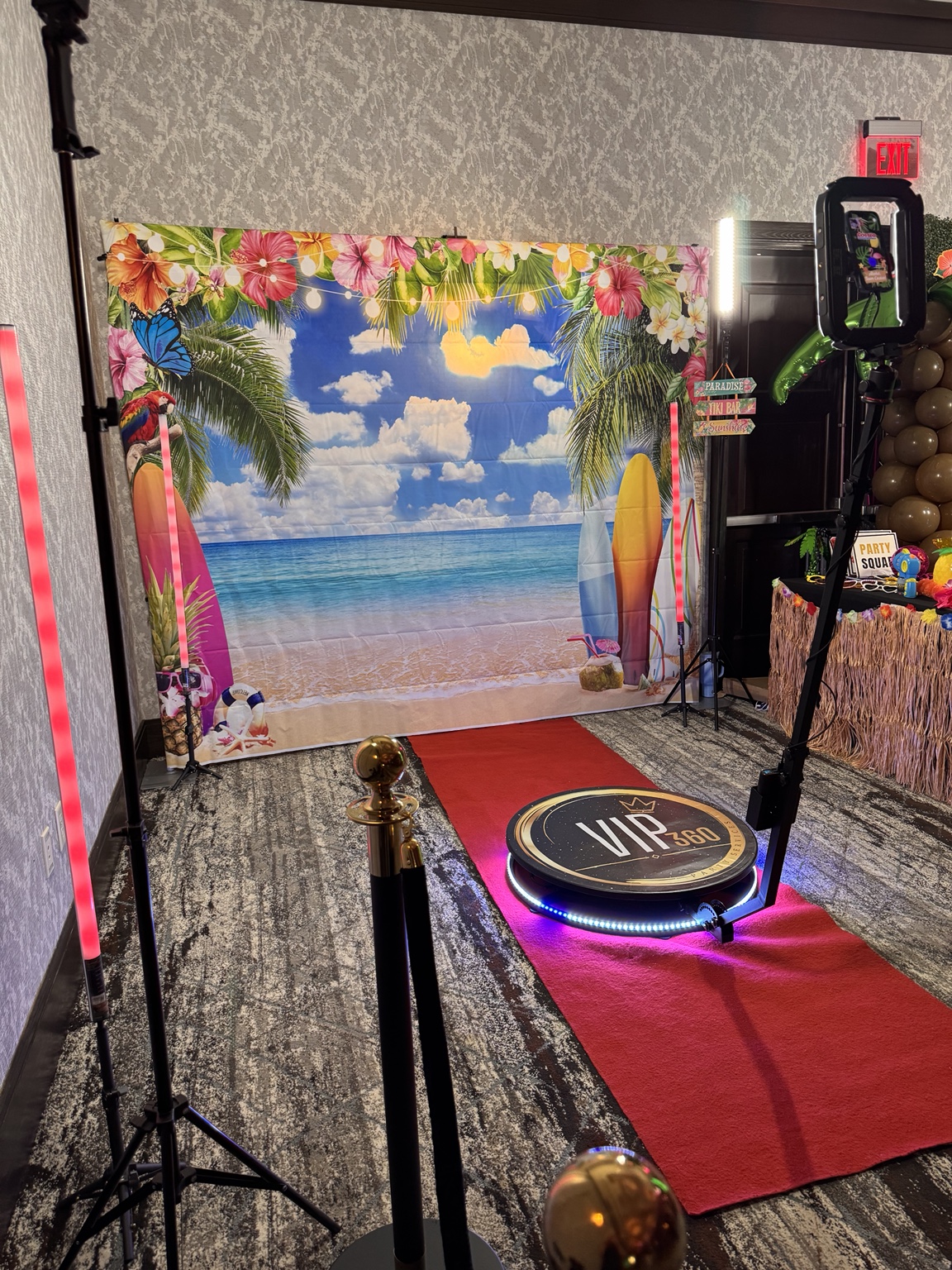 VIP 360 Video Booth with tropical backdrop and red carpet