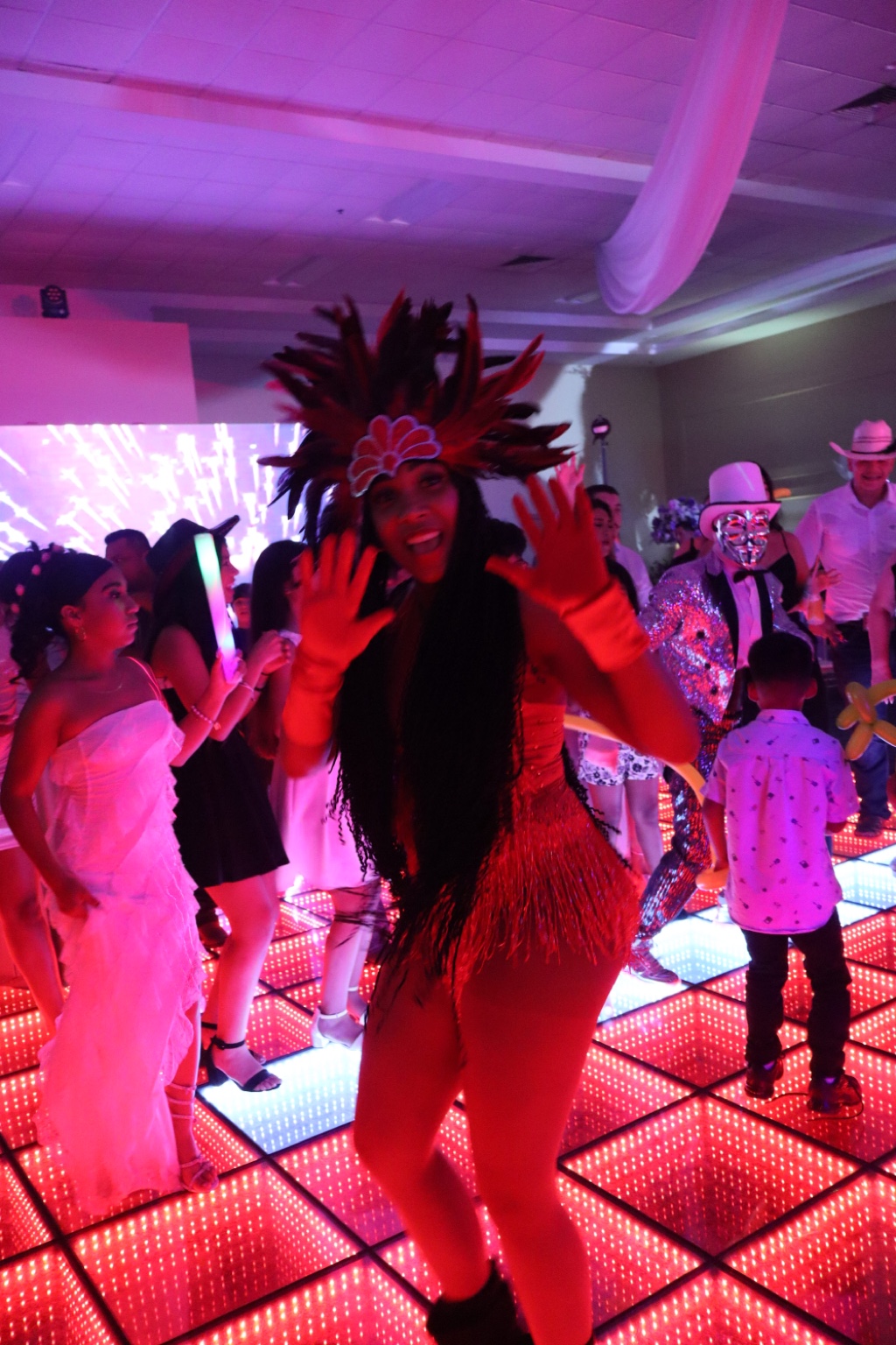 VIP Hora Loca dancer performing on an LED dance floor